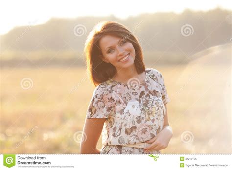 Beautiful Brunette Woman Outdoors On A Sunset Stock Image