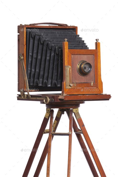 antique bellows style camera   tripod isolated  white stock photo  danthornberg
