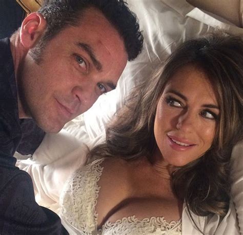 Elizabeth Hurley Flaunts Extreme Cleavage In Sexy Bed