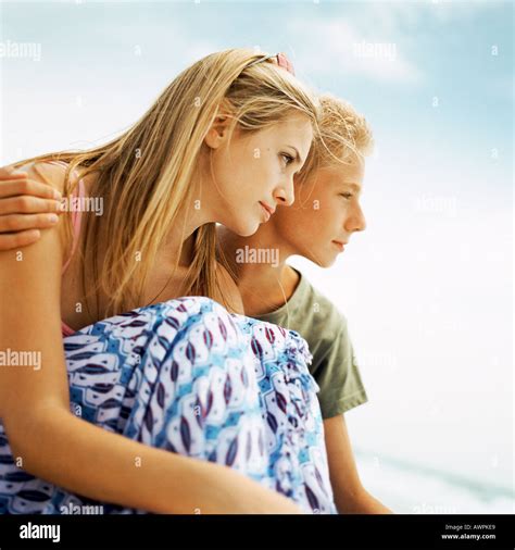 young people sitting side  side  side view stock photo alamy