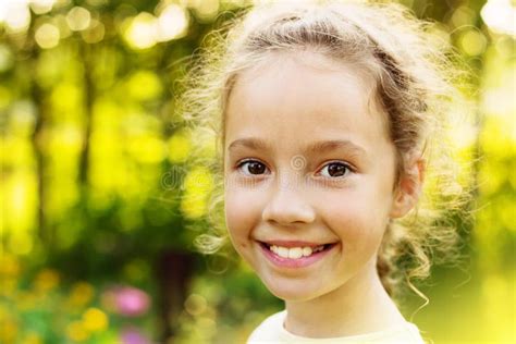 Little Cute Girl Is Smiling In The Sunny Summer Evening Stock Image