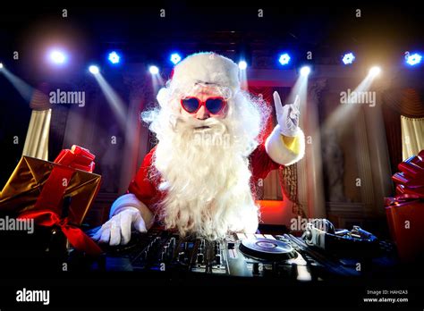 dj santa claus mixing   party christmas stock photo  alamy