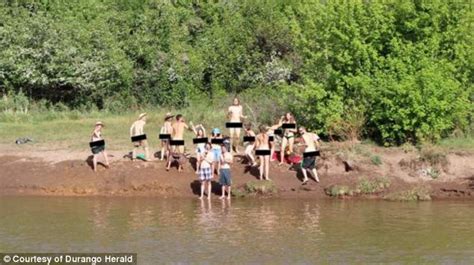 bum show for tourists as nude partiers greet train by