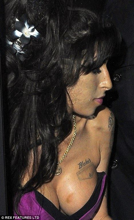 What Is That On Amy Winehouses Breast Dorties Daily Yo Lol