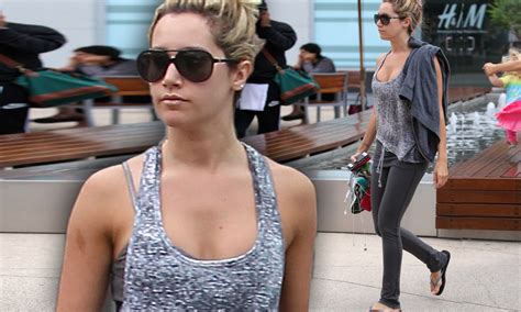 ashley tisdale shows off toned and tanned arms and figure as she leaves