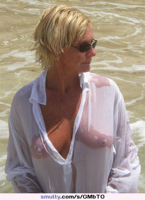 blonde milf mature sunglasses wetshirt beach vacation tanned seethrough nipples