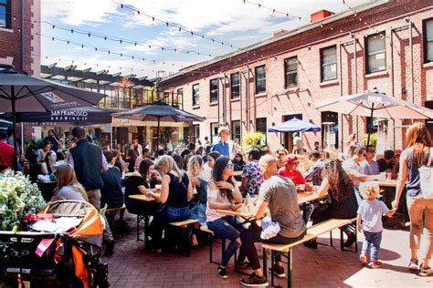 ghirardelli square restaurant patio with guests seated at tables under