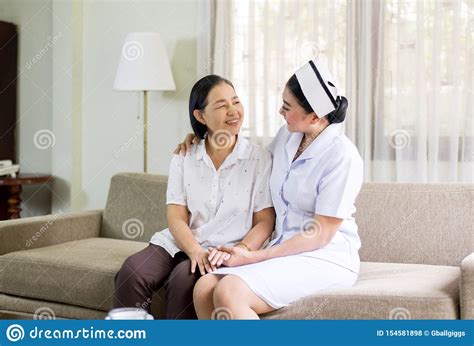Nurse Taking Care Of Her Patient Mature Asian Elderly Woman Senior