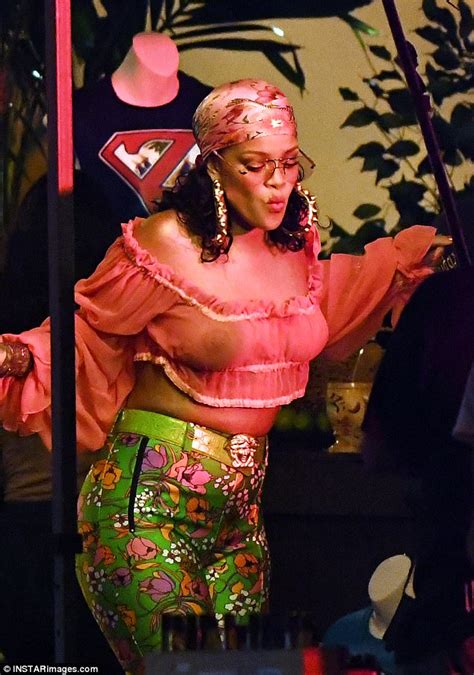 rihanna shows off her nipple piercing in miami daily