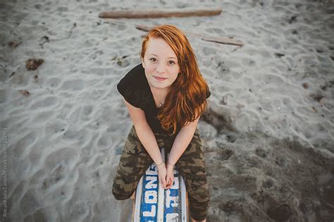Content Portrait Of Redhead Teenage Girl Sitting At The Beach By Rob