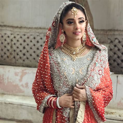 image may contain 1 person beautiful bridal dresses pakistani