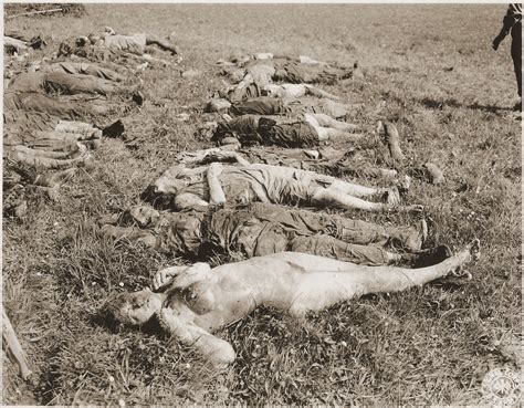 the corpses of female prisoners exhumed from a mass grave