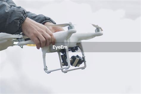 angle view  person holding drone id