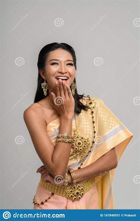 Beautiful Thai Woman Wearing A Thai Dress And A Happy Smile Stock Image
