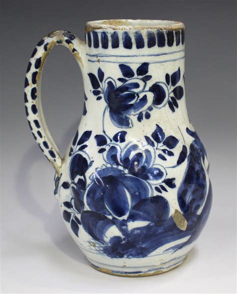 dutch delft jug late thth century  spiralling ribbed body painted  blue   peacock