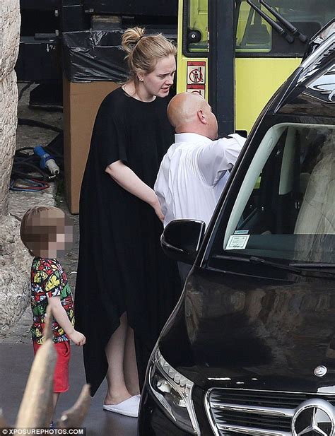 adele opts for a low key look as she steps out with son