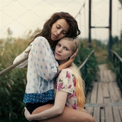 lesbian couple together outdoors concept ~ people photos ~ creative market