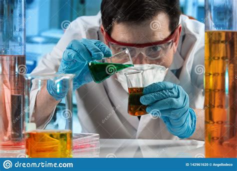scientist mixing fluids   lab stock photo image  glass medical