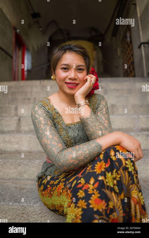 Young Happy And Beautiful Asian Woman Wearing Traditional Balinese