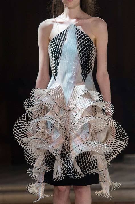 sculptural fashion 3d dress with intricate symmetry wearable art