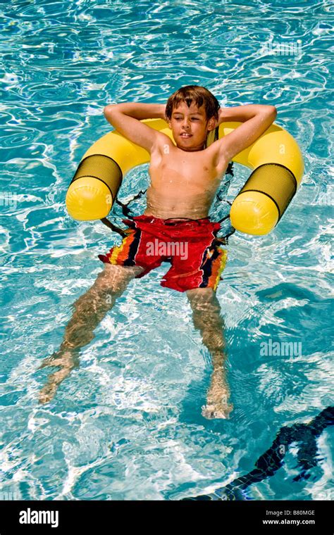 ten year  boy floats   swimming pool  laguna niguel ca stock photo alamy