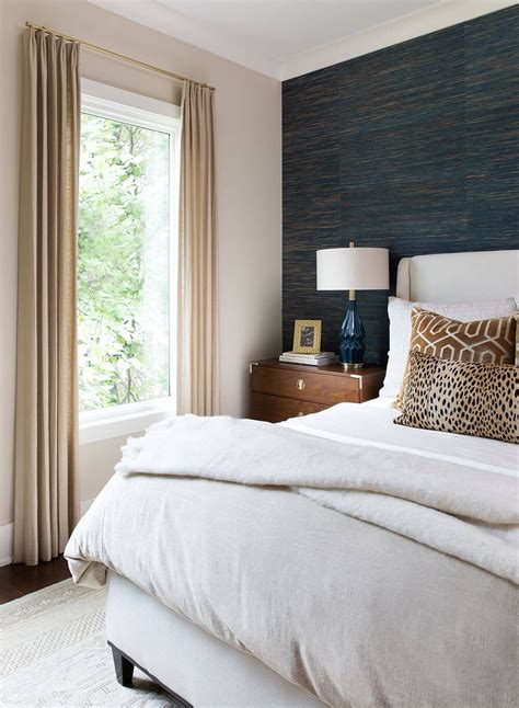 transitional bedroom  beautiful upholstered bed topped  velvet  leopard pillows