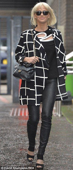 sarah harding draws attention in checked coat and leather trousers