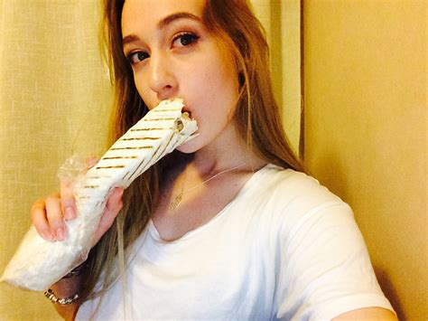 russian women are posing for sexy selfies while holding shawarma