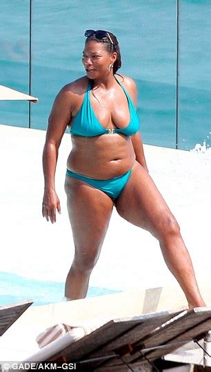 queen latifah flaunts bikini body during romantic holiday