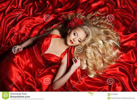 woman hair style fashion model long curly hair girl red cloth stock
