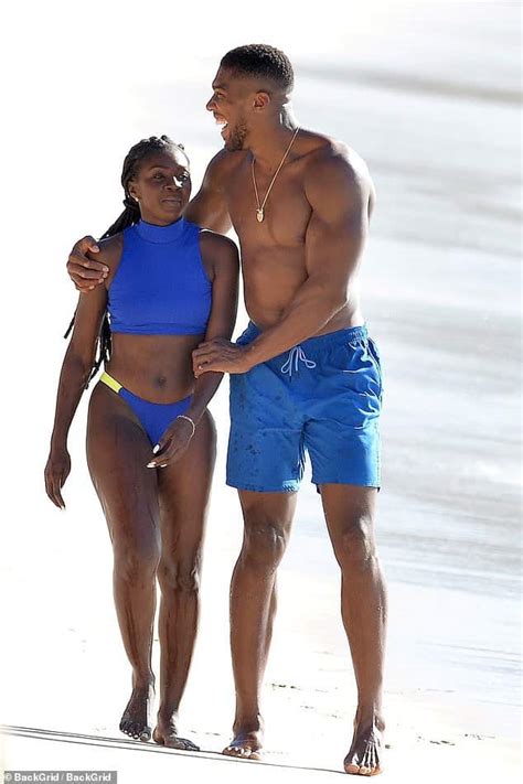 anthony joshua vacations in barbados beach with a female companion