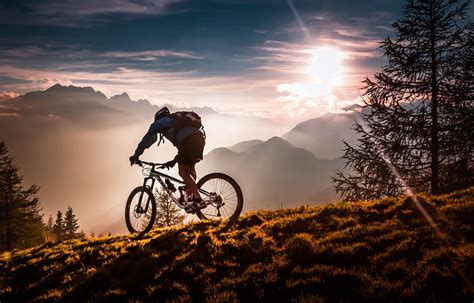 man riding mountain bike  sunset hd wallpaper wallpaper flare