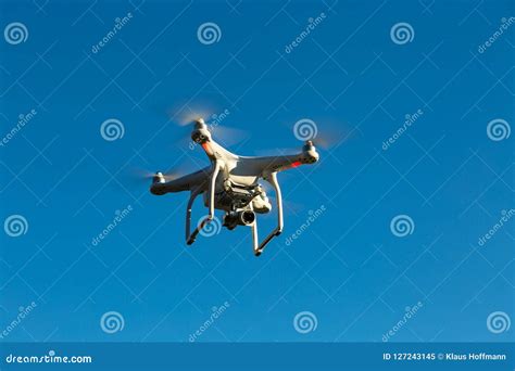 quadcopter drone flying  blue sky editorial image image  high navigation