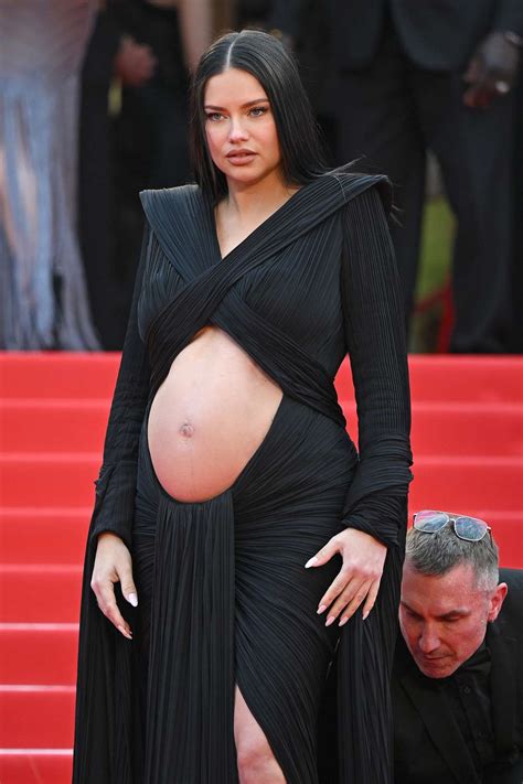 pregnant adriana lima shows  bare bump  cut  dress  cannes