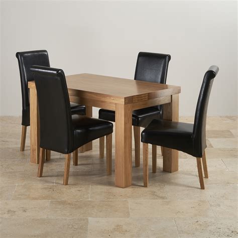 chunky ft solid oak dining table  black leather scroll chairs