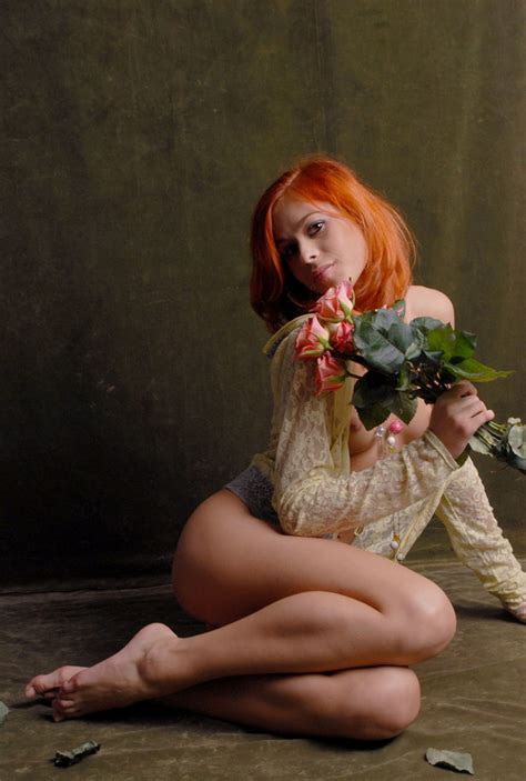 beautiful red haired girl with flowers is photographed naked russian sexy girls