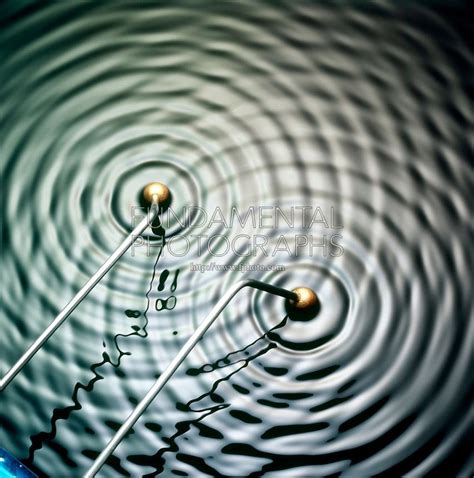 water ripples   metal balls   middle    spinning   side
