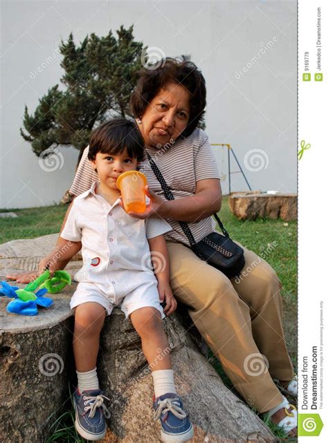 a grandmother taking care of her grandson stock image image of cheerful face 9169779
