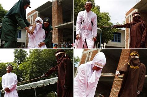 Horrific Pictures Show Woman Being Savagely Whipped By Masked Sharia