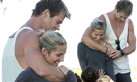chris hemsworth and wife elsa pataky play fight during