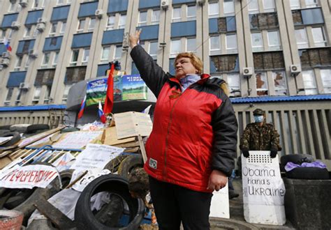 A Pro Russian Protester Gestures At A Barricade In Front