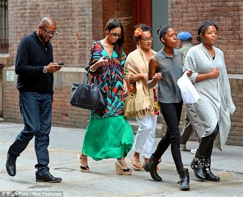 forest whitaker enjoys a leisurely stroll with his wife and two