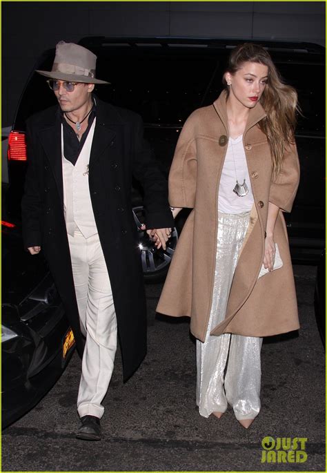 johnny depp and amber heard hold hands at cabaret opening