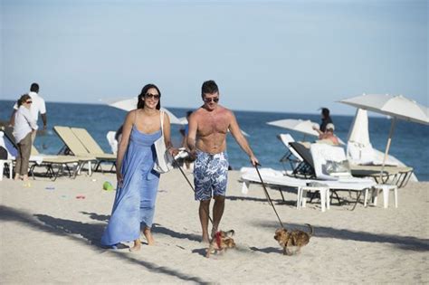 simon cowell and lauren silverman laze by the beach in miami without