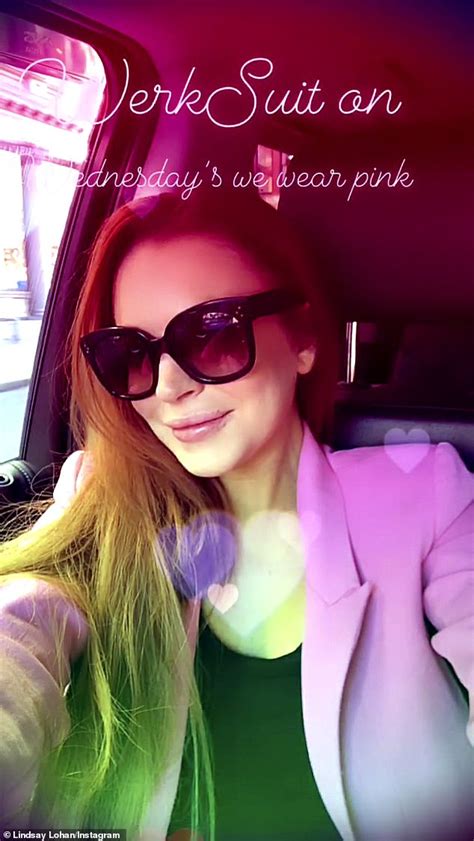 lindsay lohan has fun in hot pink suit as she blows kisses to the camera and dances at a gas