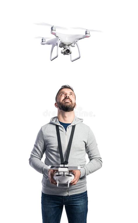 man  flying drone studio shot  white background isolated stock photo image