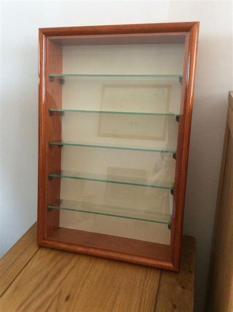 small wall mounted wooden display cabinet   glass shelves