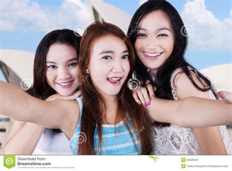 group of teen girls taking photo stock image image of