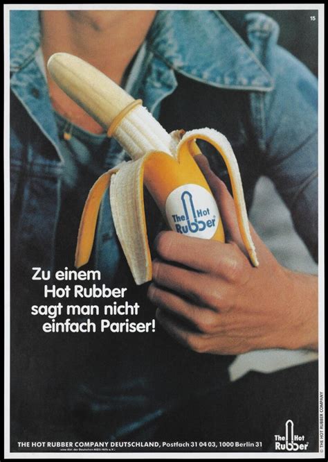A Man Holding A Peeled Banana Which Is Covered With A Condom And Has