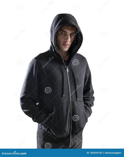 young man  hoodie  hands  pockets stock photo image  concentrated casual